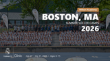 Large group of kids and trainers in Real Madrid uniforms posing for a 2026 summer soccer camp photo in Boston, MA at Milton Academy.