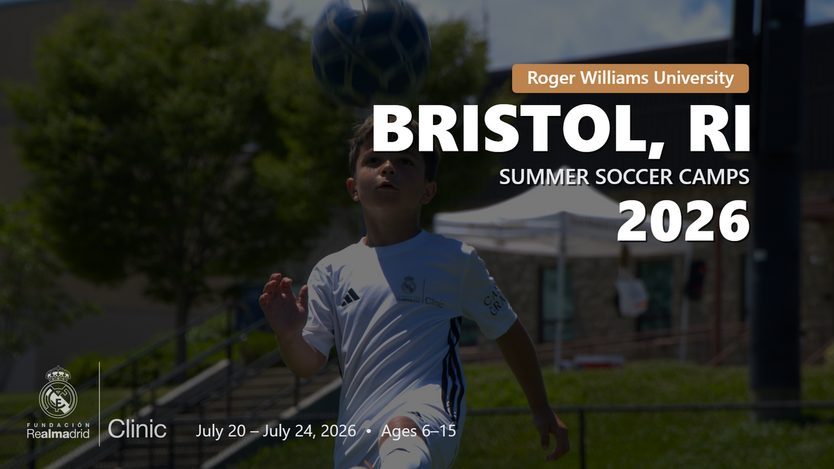 Young player in Real Madrid camp uniform heading a ball during the Bristol, RI 2026 summer soccer camp.