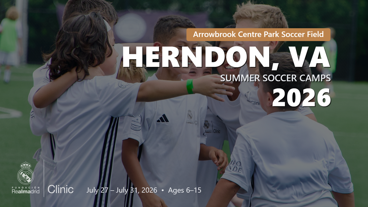 Kids in Real Madrid camp uniforms celebrating together in a group hug during the Herndon, VA 2026 summer camp.